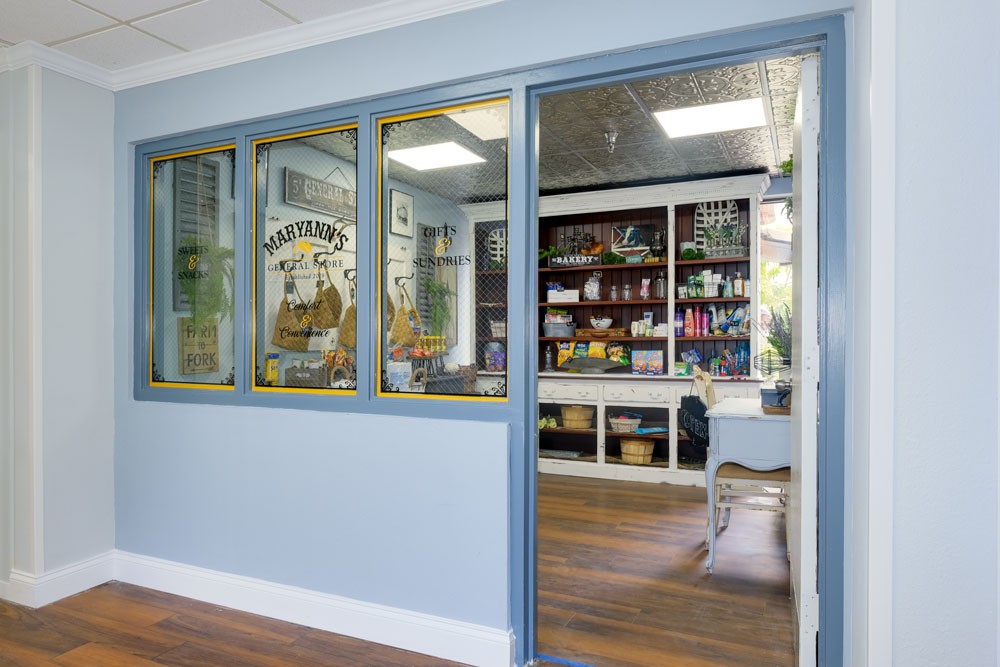 A cozy shop interior with shelves displaying various products and a wooden floor.