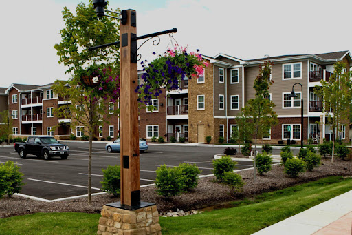 A view of a modern apartment complex with landscaped surroundings.