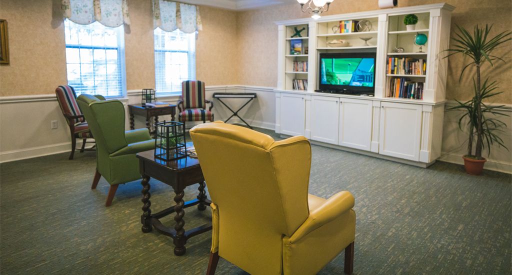 A cozy living room with comfortable seating and a television.