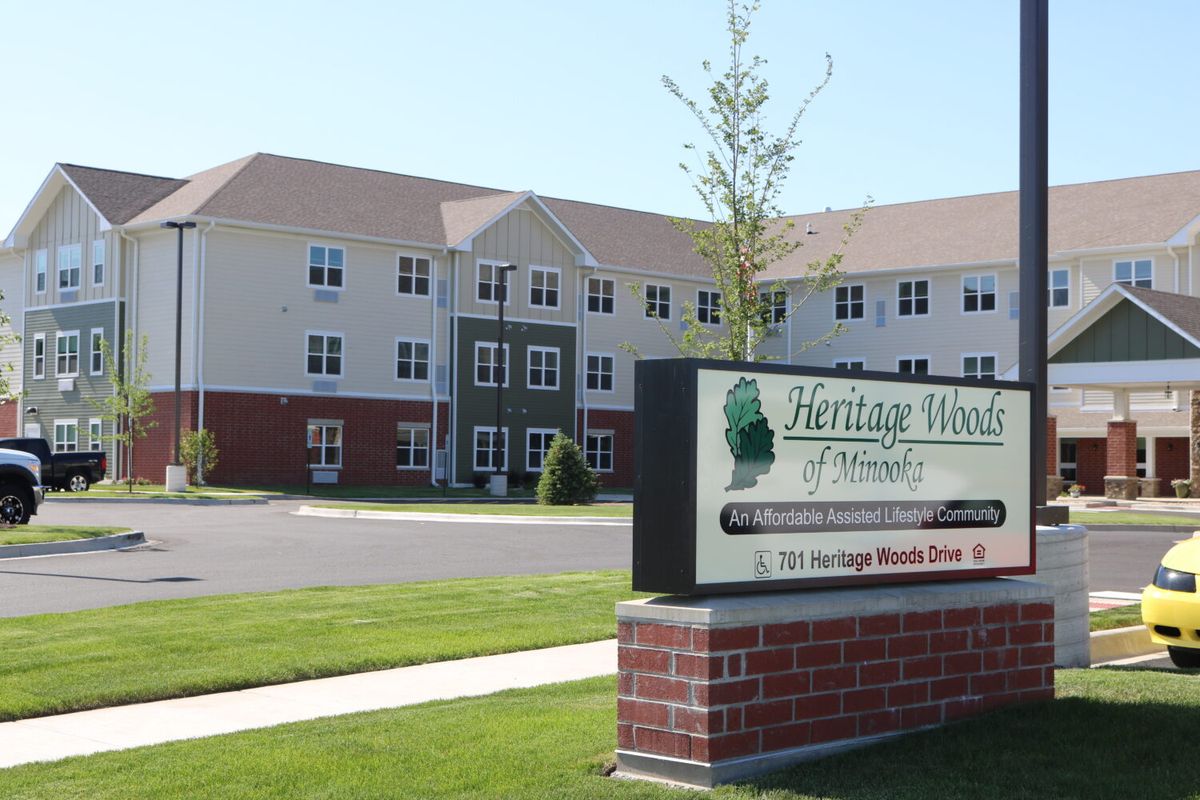A large building with a sign that reads 'Heritage Health' on a sunny day.