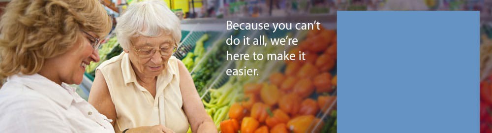 A woman shopping for vegetables with the text: 'Because you can do it all, were here to make it easier.'