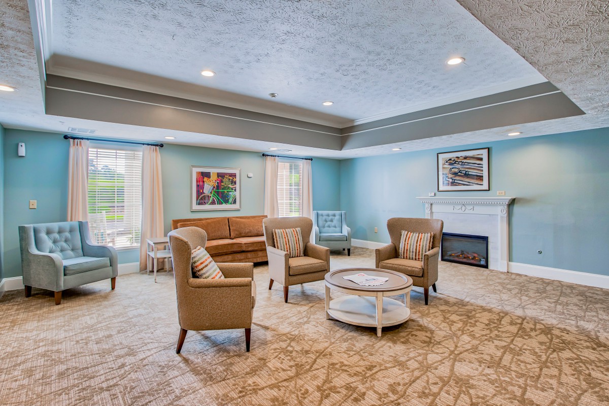 A spacious and elegantly designed living room with comfortable seating and modern decor.
