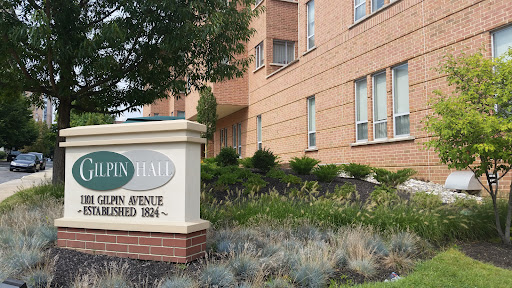 Exterior view of a residential building with a prominent sign.