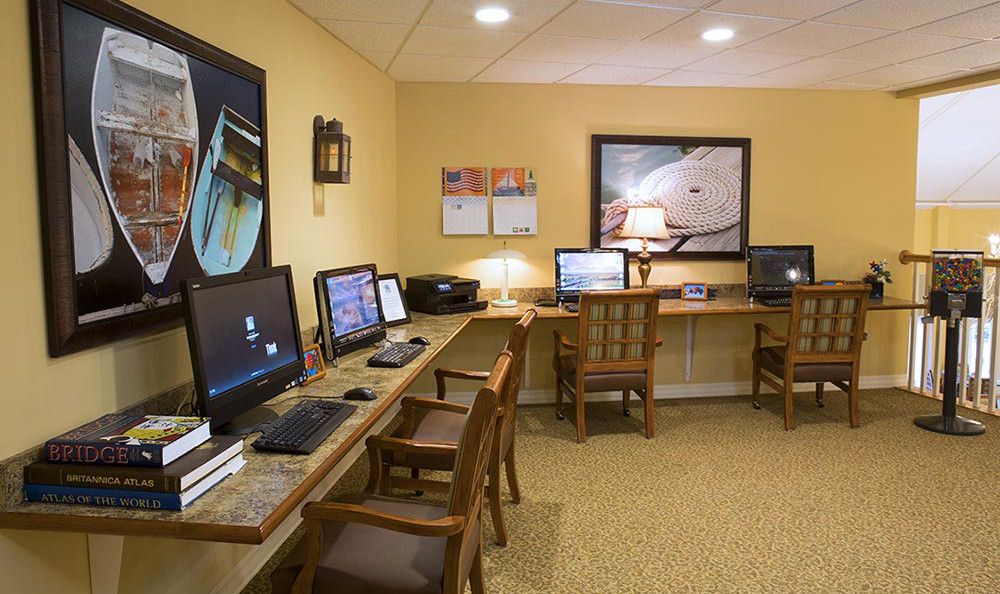 A well-organized office space with multiple computer workstations and chairs.