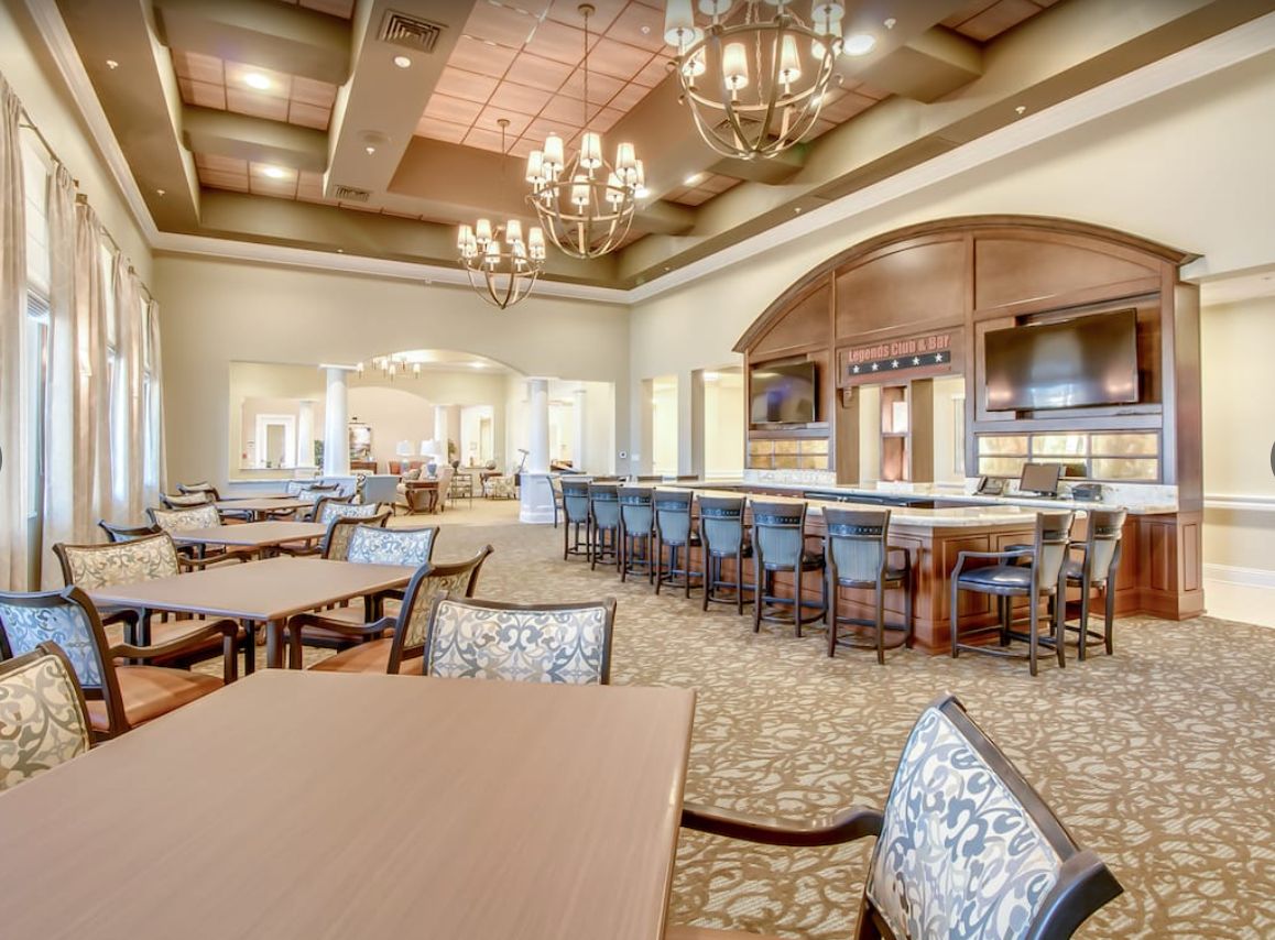 Luxurious restaurant interior with a dining area and bar counter.