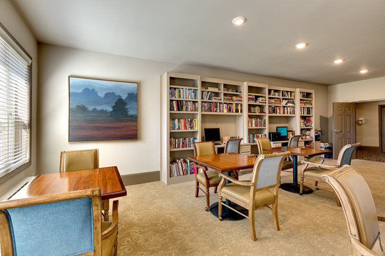 An inviting study area with bookshelves and seating.