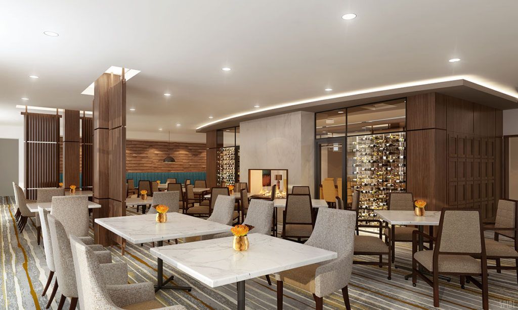 A modern restaurant interior featuring elegant tables and comfortable seating.