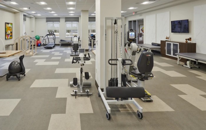 A spacious fitness center equipped with various exercise machines.
