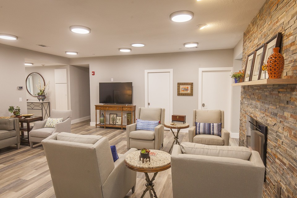 A cozy modern living room with comfortable seating and a television.