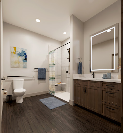 A sleek and modern bathroom featuring a walk-in shower, contemporary vanity, and stylish decor.
