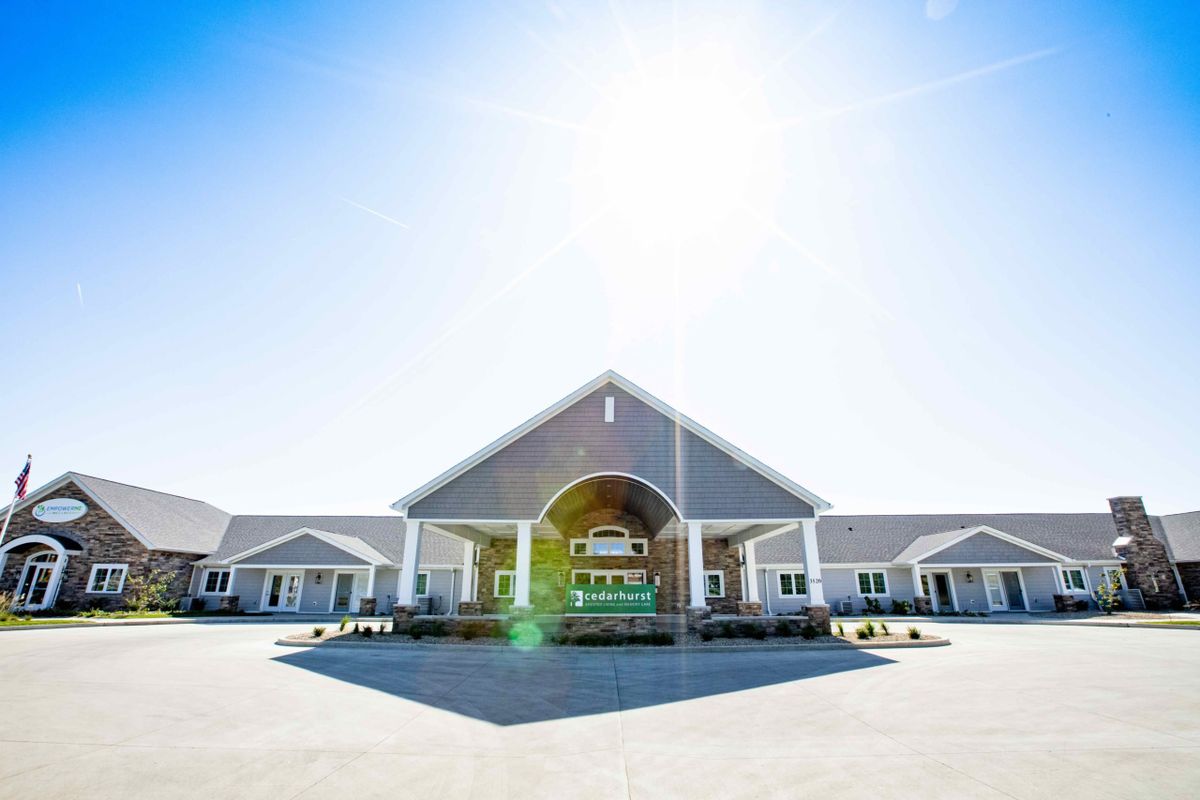 A sunny day view of a modern residential building entrance.