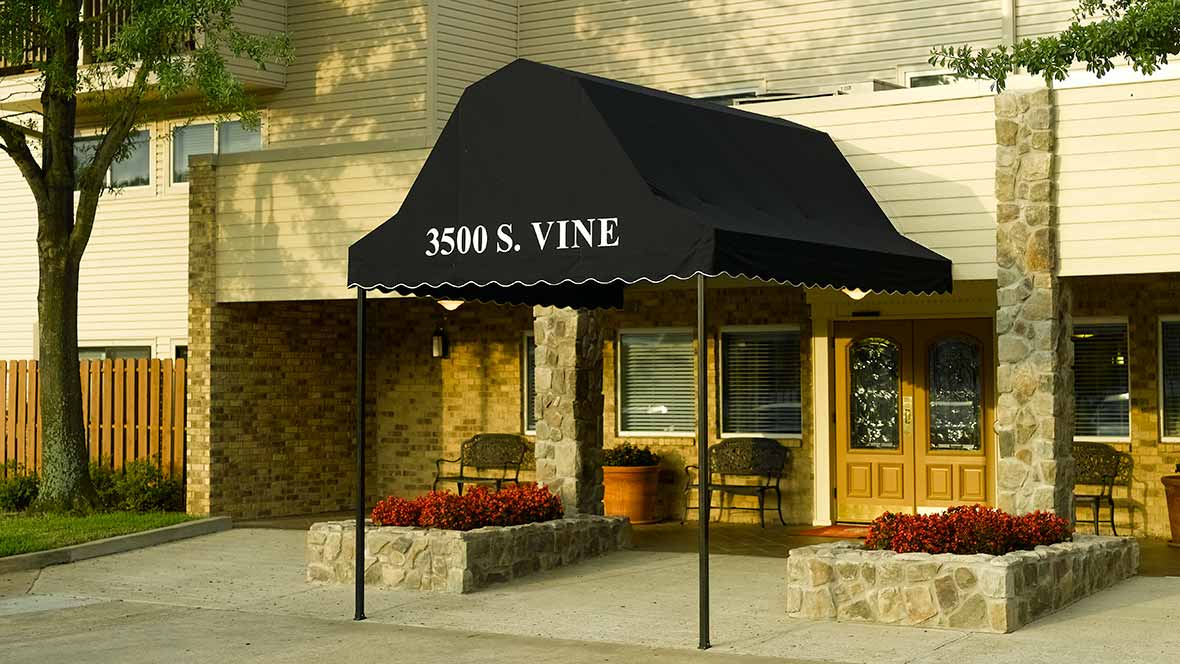 Entrance with a black awning displaying the address '3500 S. Vine'.