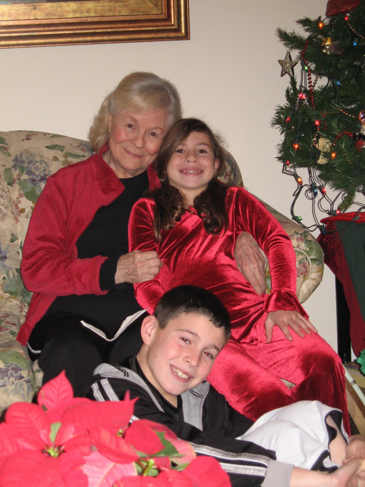 Family gathered together, celebrating Christmas indoors.