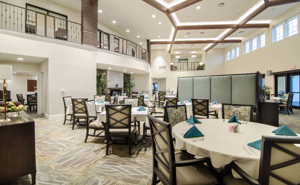 Elegant dining area with well-arranged tables and modern decor.