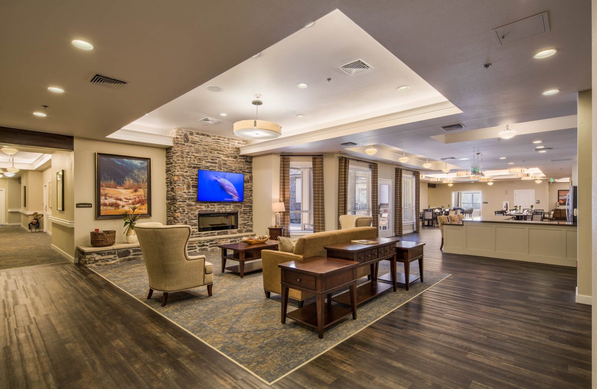 A modern living room with stylish furniture and warm lighting.