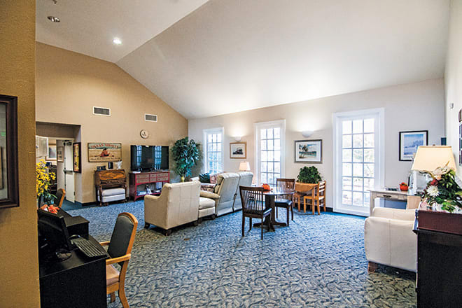 A spacious living room with comfortable seating and a television.