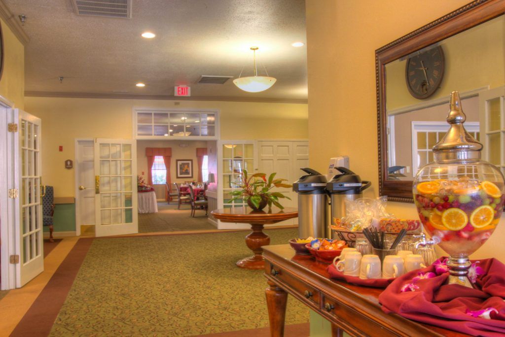 A warm and inviting lobby area featuring a coffee station and comfortable seating.