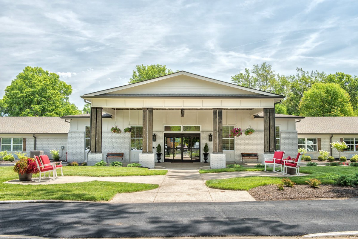 A well-maintained building with a welcoming entrance surrounded by greenery.