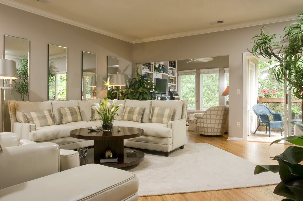 A cozy and well-decorated living room with modern furnishings and ample natural light.