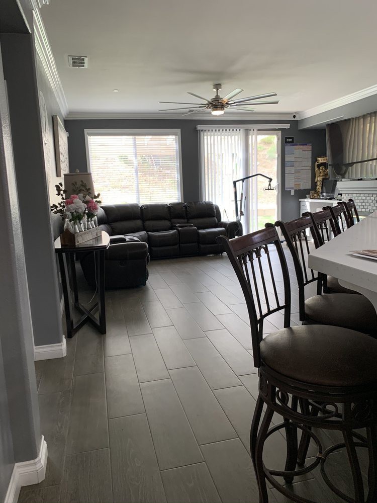 Spacious open-concept living and kitchen area with modern furnishings.