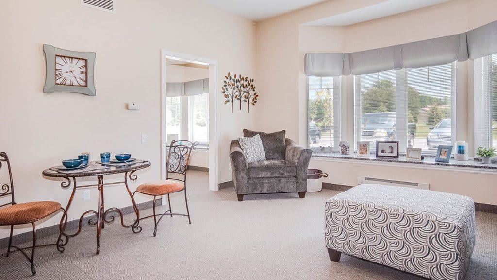A cozy living room with comfortable seating, large windows, and tasteful decor.
