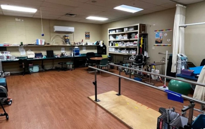 A therapy room equipped with exercise and rehabilitation tools.