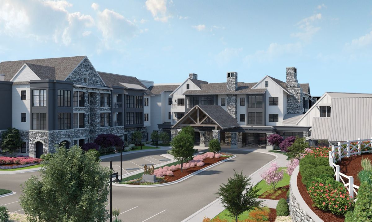 A modern residential building with landscaped surroundings and a welcoming entrance.