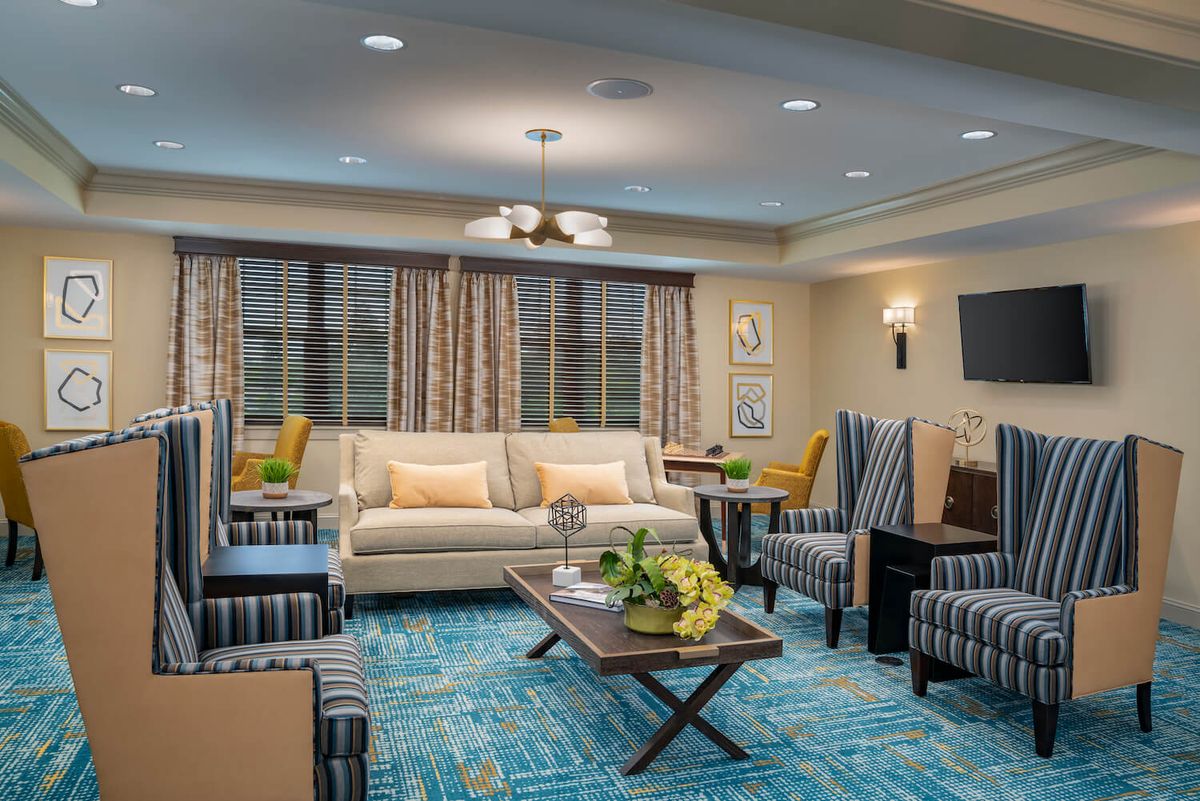 A modern living room with comfortable seating and stylish decor.