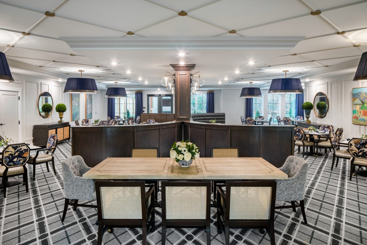 A modern restaurant interior with a stylish dining area and elegant decor.