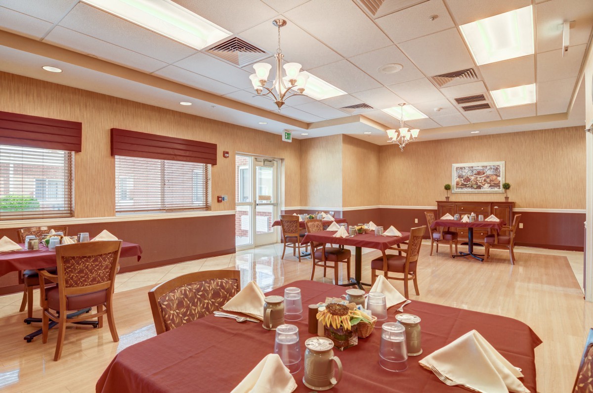 A beautifully arranged dining room with tables set for a meal.