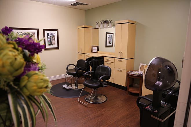 A cozy salon setup with hairdressing chairs and equipment.