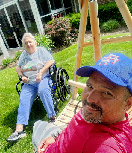 Enjoying a sunny day together in the garden, sharing smiles and memories.