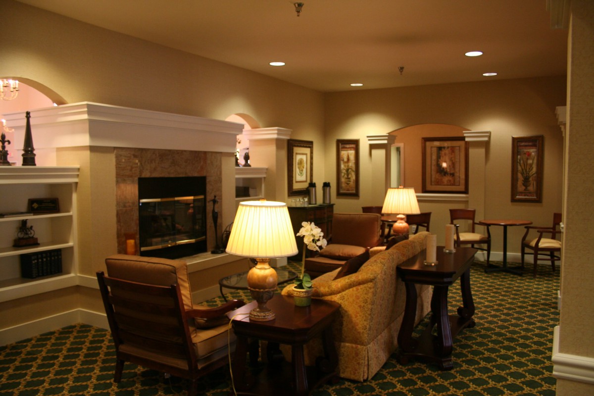 A cozy living room with comfortable seating and warm lighting.