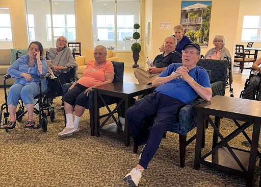 A group of seniors enjoying a social gathering at a community center.
