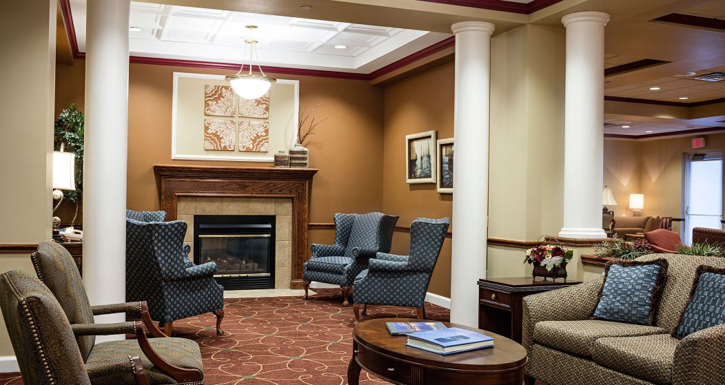 Images showing dining, interior, seating area, fireplace, artwork, apartment building, landscaping, lake, and more.