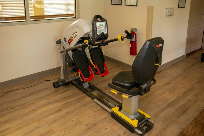 An exercise machine in a gym setting, designed for indoor workouts.