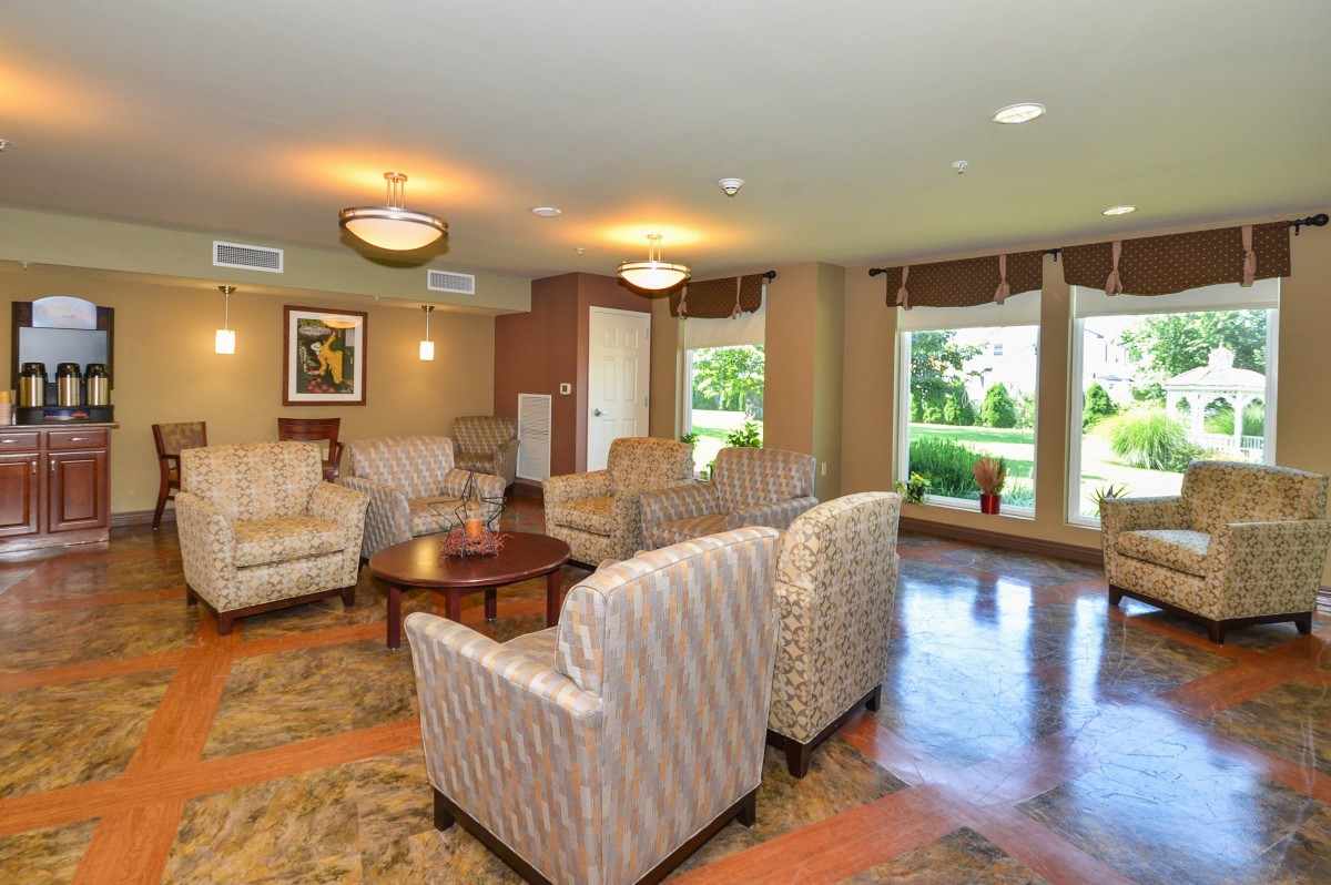 A cozy living room with comfortable seating and natural lighting.