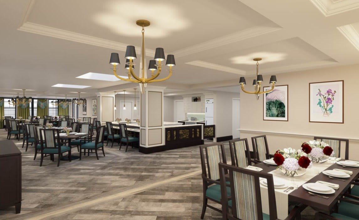 A modern dining room featuring elegant chandeliers and stylish seating arrangements.