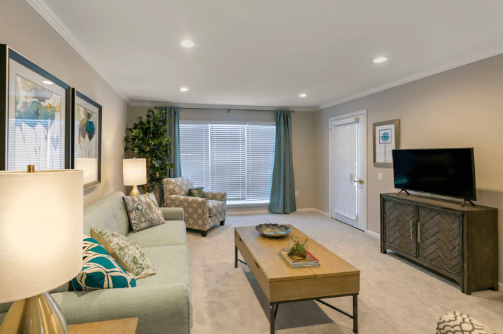 A modern living room with neutral tones and stylish decor.
