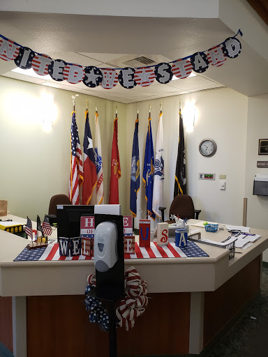 A festive office space decorated with various flags and patriotic themes for Independence Day celebrations.