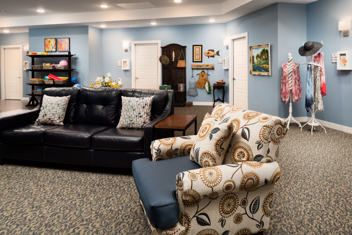A cozy living room with comfortable seating and colorful decor.