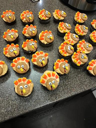 A delightful batch of Thanksgiving-themed turkey cupcakes, perfect for festive celebrations.