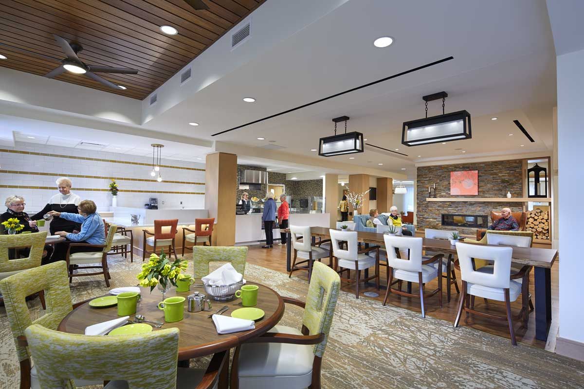 A modern dining area with stylish furniture and ambient lighting.
