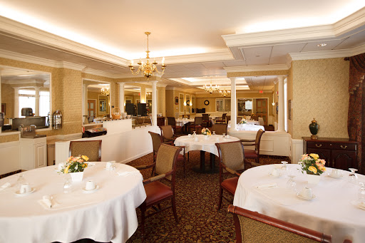 An elegant dining area featuring beautifully set tables and tasteful decor.
