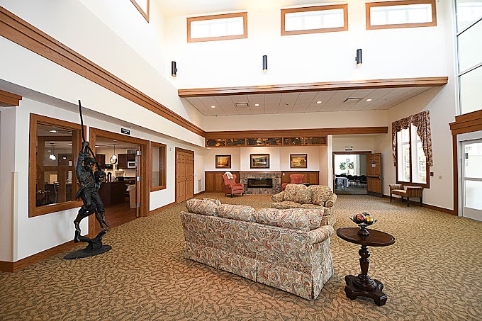 A spacious lobby area with comfortable seating and decorative artwork.