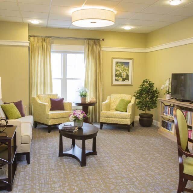 A cozy and elegantly designed living room with comfortable seating and tasteful decor.