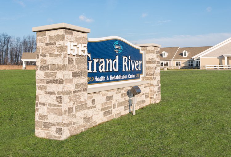 Grand River Health & Rehabilitation Center sign outside a building.