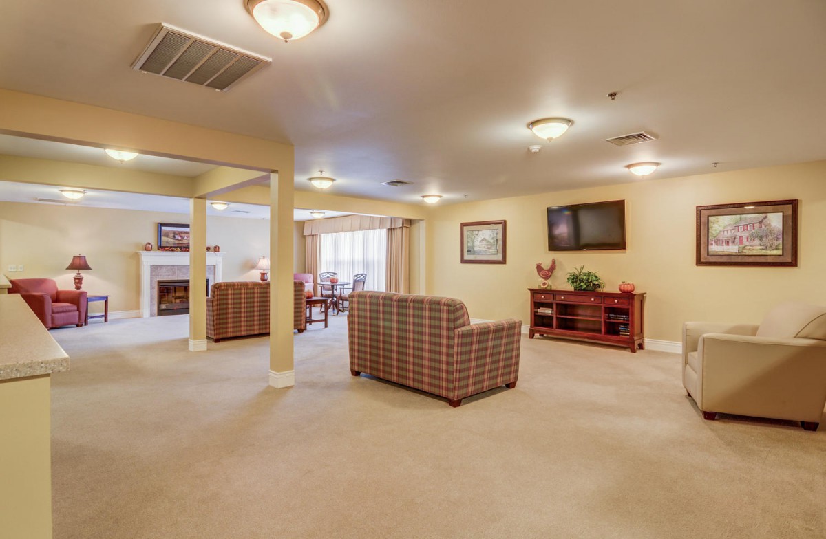 A spacious living room with stylish furnishings and a cozy atmosphere.