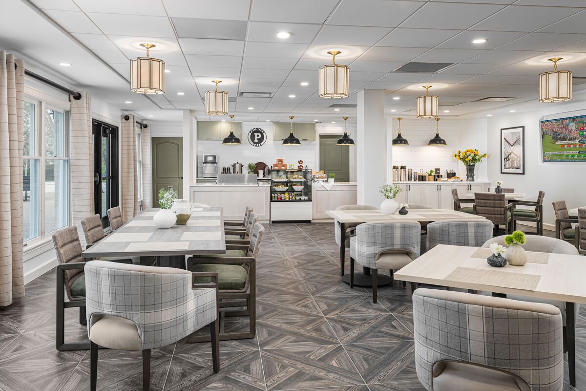 A modern restaurant interior with stylish furniture and lighting.