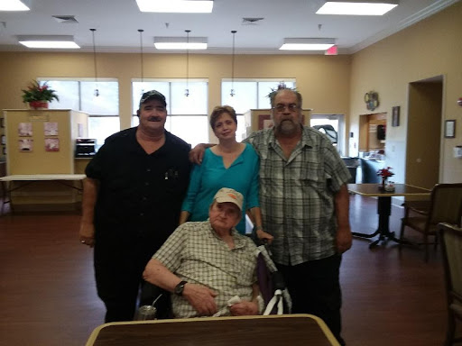 A family gathering at a care facility, showcasing love and support among loved ones.